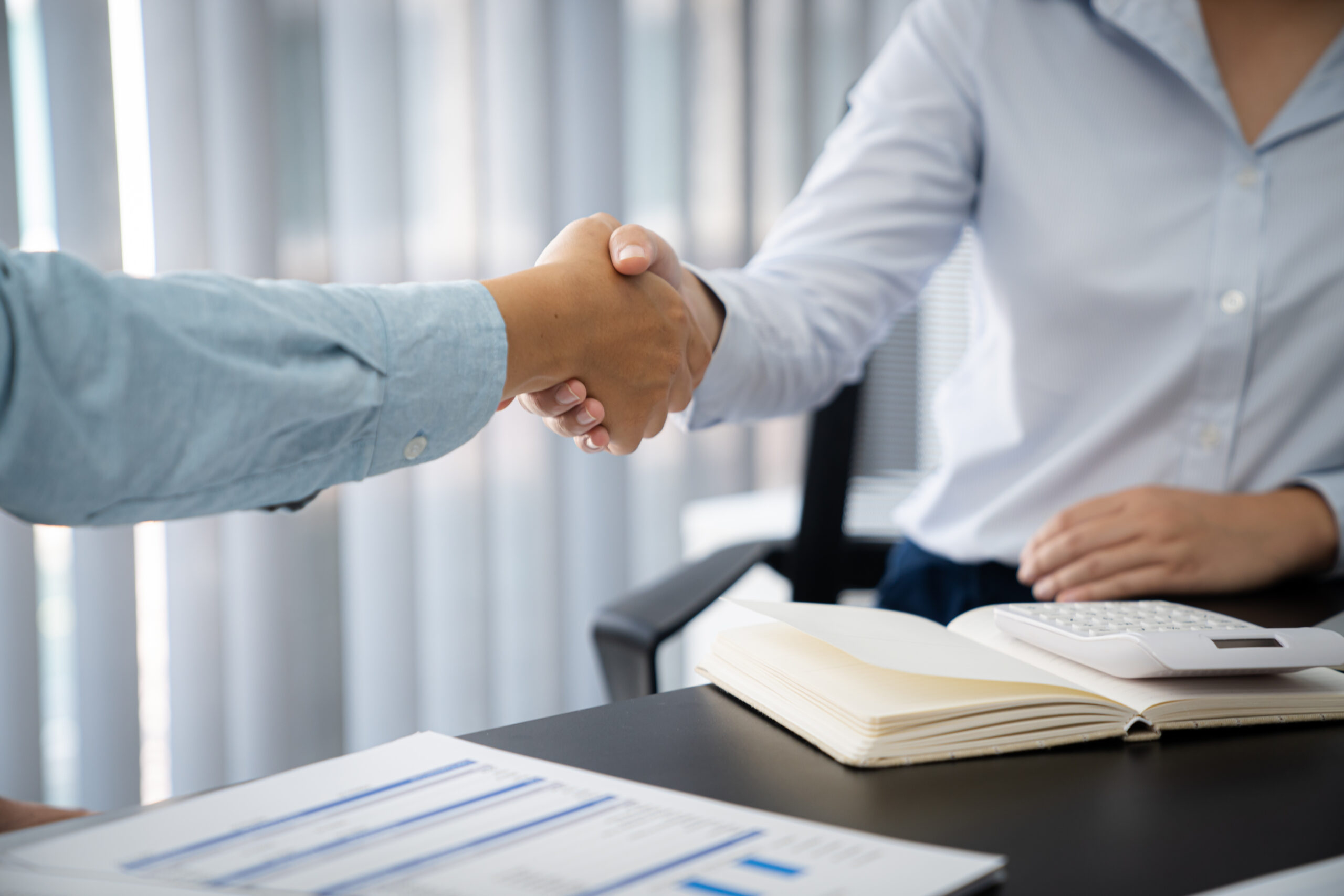 Businessman shaking hands successful making a deal. mans handsha